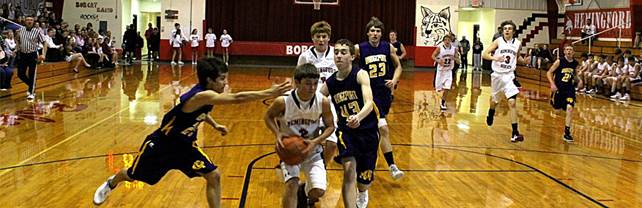 Description: S:\STAFF\cningen\ARC. PIX\BASKETBALL\BOYS BB\BBB 2011-12\BBB vs Bport 2011\Brady and Matt on the drive.JPG