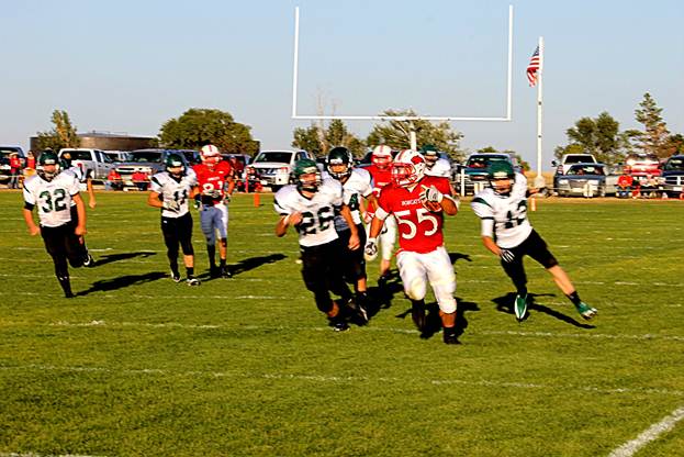 Description: \\fileserver01\staff\cningen\My Documents\My Pictures\Homecoming 2011\Tanner Lembke on a long run against Thed.Sand. 2011.JPG
