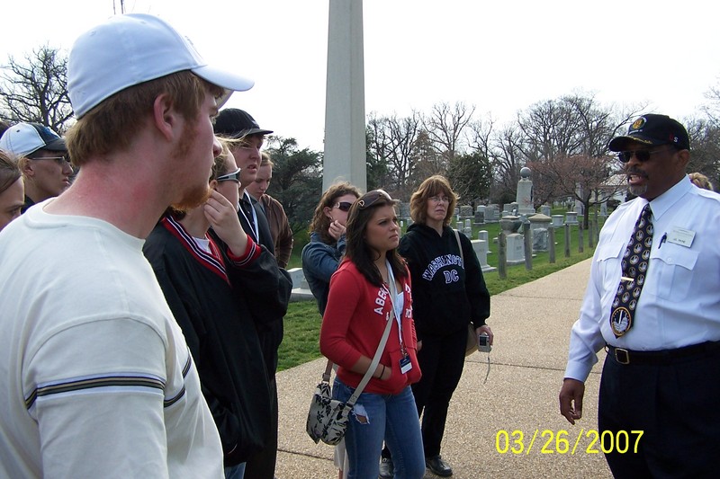 JD Paine our tour guide and bus driver gives the students some of the history of Arlington Semetary